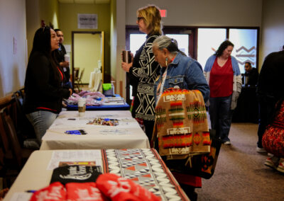 woman standing at an event table