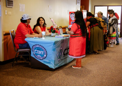 people standing at an event table