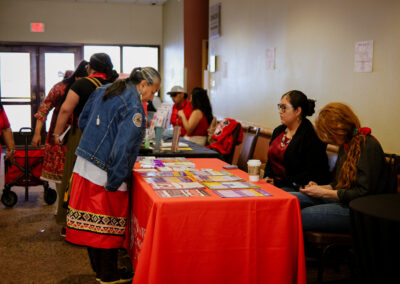 people standing at an event table from a different angle
